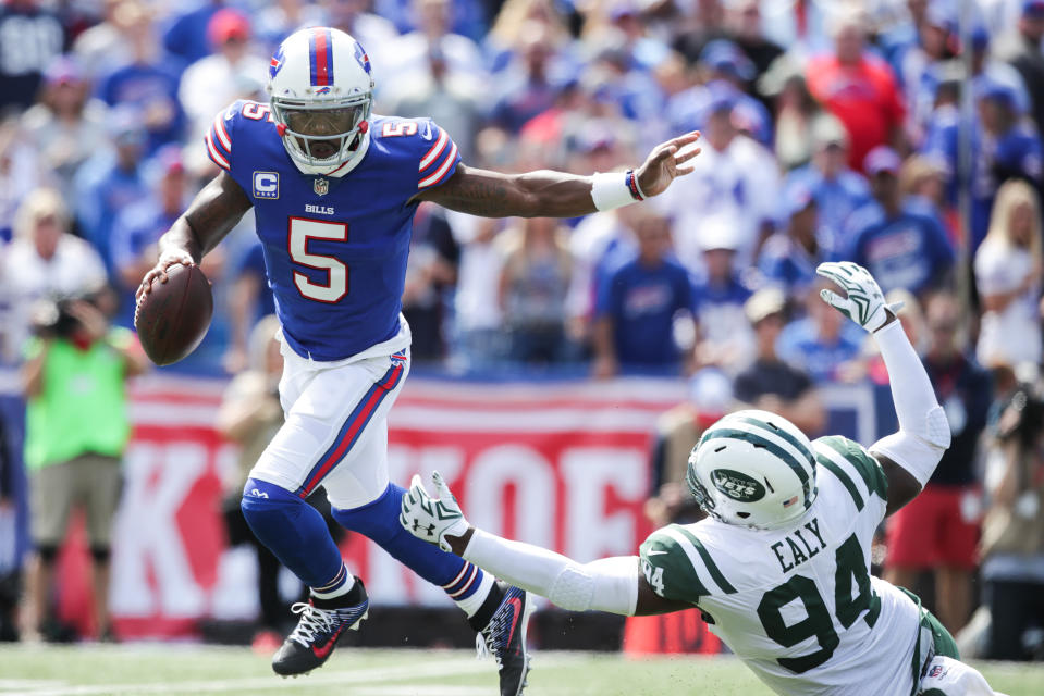 <p>Tyrod Taylor #5 of the Buffalo Bills runs the ball as Kony Ealy #94 of the New York Jets attempts to tackle him during the first quarter on September 10, 2017 at New Era Field in Orchard Park, New York. (Photo by Brett Carlsen/Getty Images) </p>