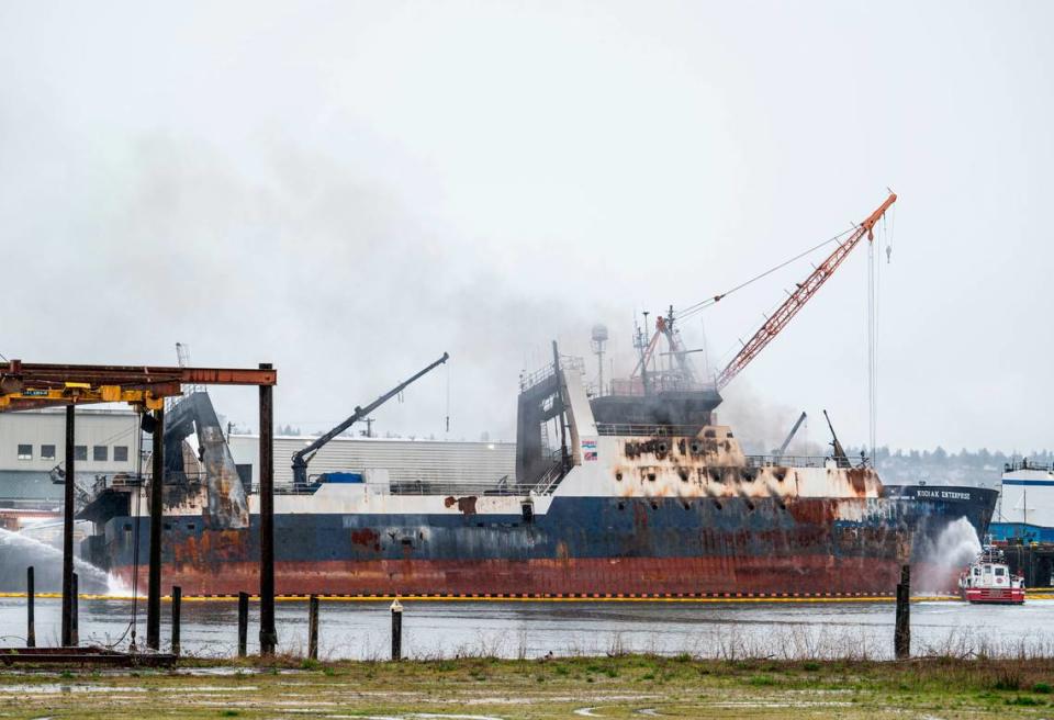 Tacoma fire crews work to put out a fire that broke out Saturday on the fishing vessel Kodiak Enterprise, while it was docked in Hylebos Waterway in the Port of Tacoma in Tacoma, Wash. on April 10, 2023.