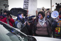 Activists momentarily surround an MPD cruiser during a march for Tyre Nichols, who died after being beaten by Memphis police during a traffic stop, in Memphis, Tenn., on Saturday, Jan. 28, 2023. (Patrick Lantrip/Daily Memphian via AP)