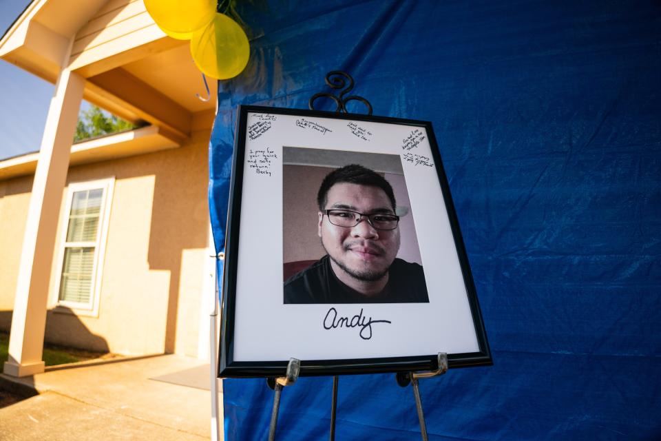 A portrait of Hartselle, Alabama native Andy Huynh surrounded by handwritten well-wishes of family, friends and locals rests under a tent outside of Forest Lake United Methodist Church during the Tuscaloosa Metro Animal Shelter’s Big Dogs, Big Hearts adoption event. The event is raising awareness for Andy Huynh and Alex Drueke, the two Alabama residents being held in Russian captivity after volunteering to fight along side the Ukrainians in their war against Russia.Saturday August 13, 2022. [Photo/Will McLelland] 