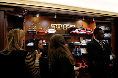 Guests shop for Trump branded items at Trump's Sweet Shop in the lobby of Trump Tower in New York City, U.S., November 23, 2016. Picture taken November 23, 2016. REUTERS/Brendan McDermid