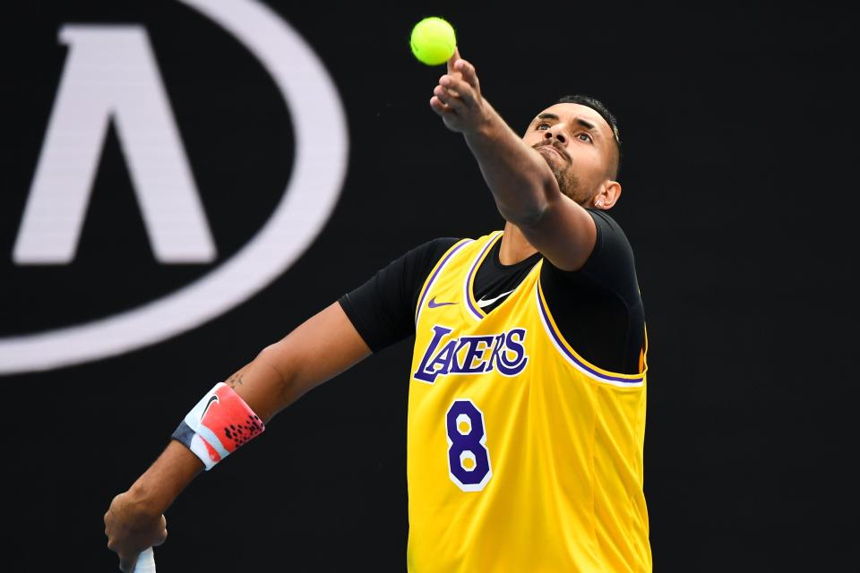 Nick Kyrgios, pictured serving during warmups, was one of many athletes to honor Bryant following his death. (Photo: WILLIAM WEST via Getty Images)