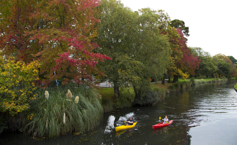 FILE - In this April 19, 2017, file photo, kayakers paddle down the Avon River in Christchurch, New Zealand. Despite its tranquility and beauty, New Zealand city of Christchurch is painfully familiar with trauma and will need to use that experience to recover from terrorist attack. (AP Photo/Mark Baker, File)