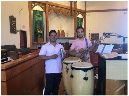 St. John’s Episcopal Church's Spanish Service feature musicians with conga drums, a shaker and guitar.