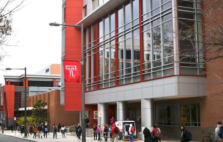 Students walk through the campus of Temple University, which has an enrollment of more than a 38,000 and offers 464 academic degree programs, in Philadelphia, Pennsylvania, U.S. on December 1, 2016. REUTERS/Mark Makela