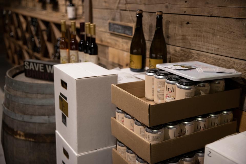 Lush Wine Company canned wine is displayed on a barrel at Barrel and Keg in Salem, Ore. on Thursday, Jan. 20, 2022. 