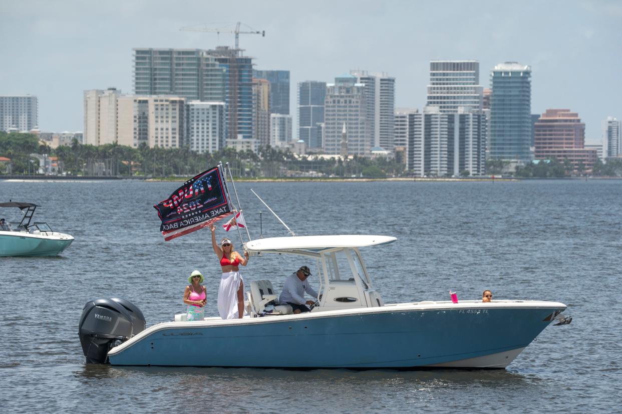 Supporters fly flags on their boat near Mar-a-Lago the home of former President Donald Trump on July 14, 2024, in Palm Beach, Florida.Trump survived an Trump survived an assassination attempt while speaking at a rally on Saturday in Pennsylvania.