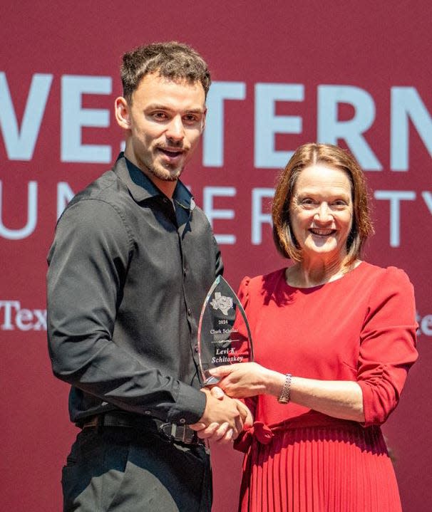 MSU Texas President Stacia Haynie presents the Clark Award to Levi Kevin Schitoskey.