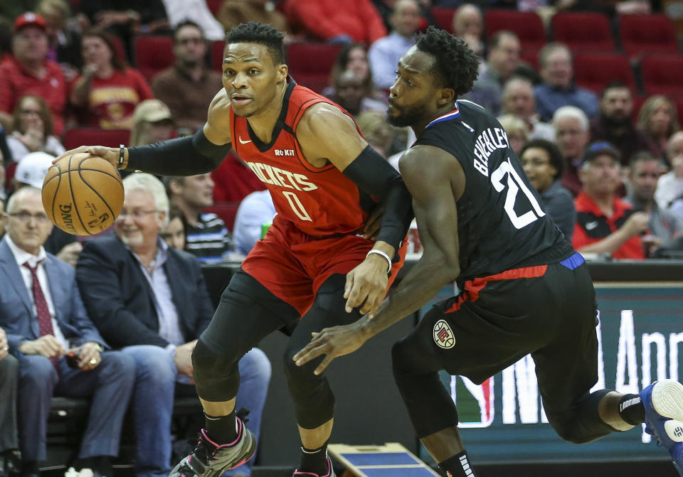 Mar 5, 2020; Houston, Texas, USA; Houston Rockets guard Russell Westbrook (0) dribbles the ball as Los Angeles Clippers guard Patrick Beverley (21) defends during the first quarter at Toyota Center. Mandatory Credit: Troy Taormina-USA TODAY Sports