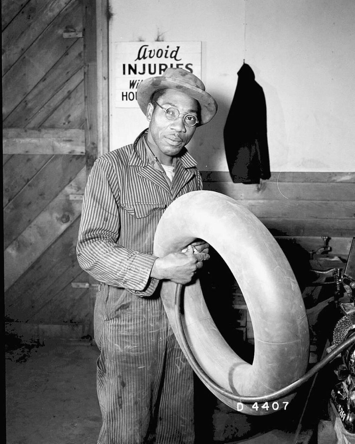 An employee repairs an inner tube for a tire at Hanford during World War II. Most black workers were assigned to unskilled labor, despite skills they brought to the project.