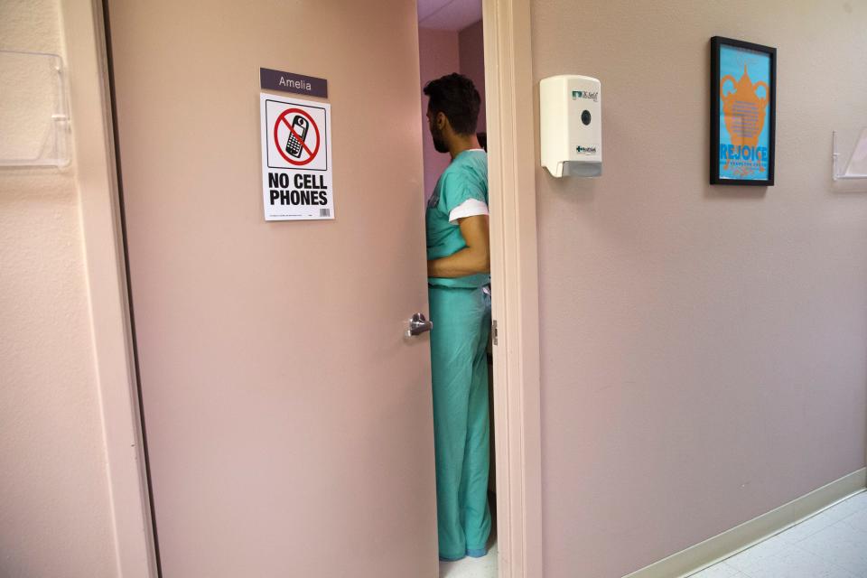 later abortion_doctor preps for procedure