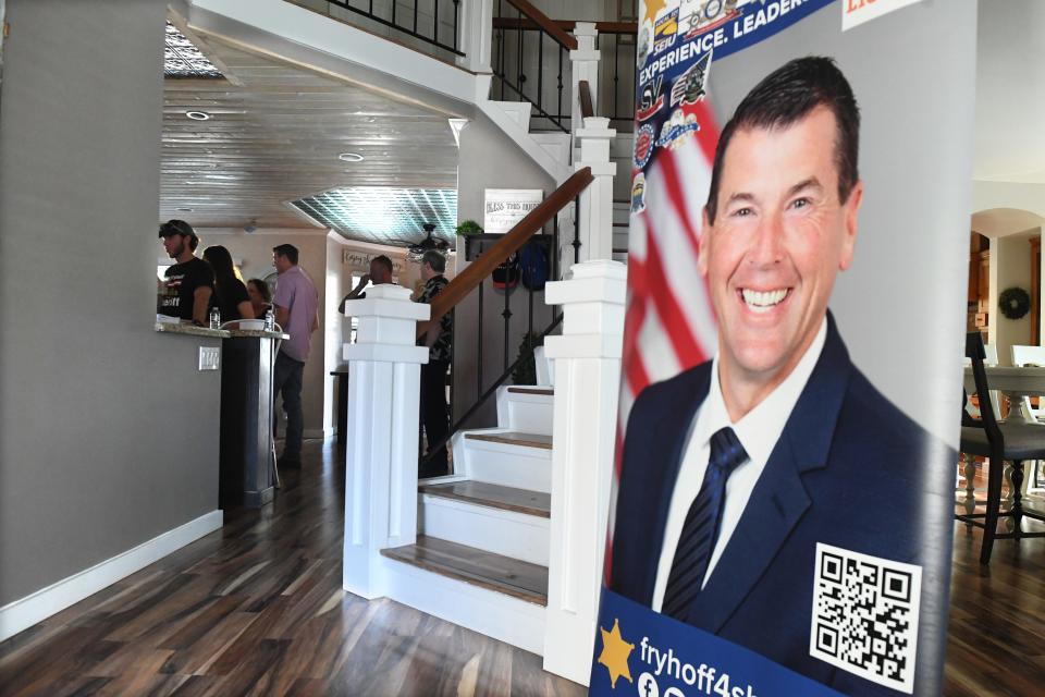 Signs and balloons decorate the home of Ventura County Sheriff's Cmdr. Jim Fryhoff as he celebrates his daughter Vanessa's 18th birthday with family and friends while they await election results on Tuesday, June 7, 2022. He was ahead of Sheriff Bill Ayub after the first round of returns.