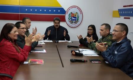 Venezuela's President Nicolas Maduro (C) speaks during a meeting with government members at the Miraflores Palace in Caracas, Venezuela October 15, 2017. Miraflores Palace/Handout via REUTERS