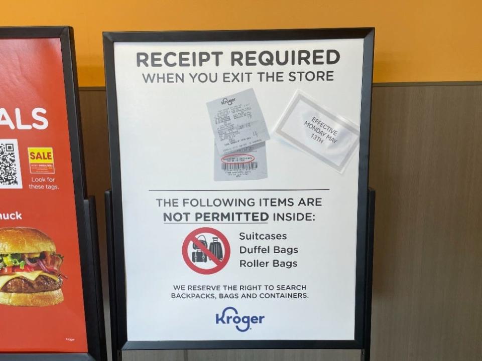 A sign outside of a Columbus-area Kroger prohibits large bags inside the store and tells shoppers they'll be required to submit to a receipt check when they exit.