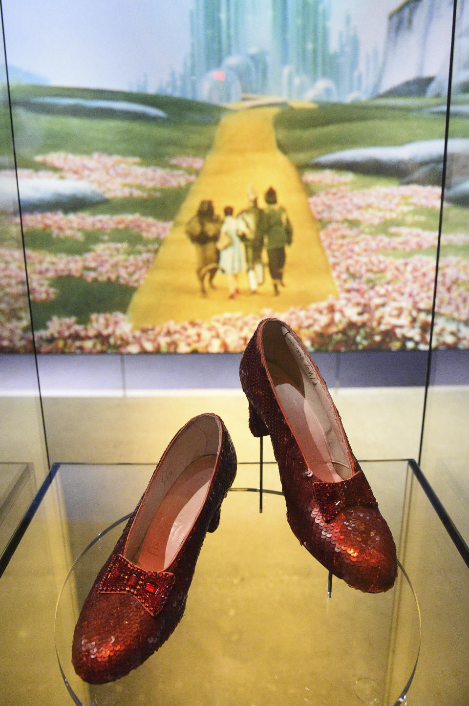 FILE - A pair of ruby slippers worn by Judy Garland in "The Wizard of Oz" are displayed at the Academy Museum on Tuesday, Sept. 21, 2021, in Los Angeles. A dying thief who confessed to stealing the slippers because he wanted to pull off “one last score,” was given no prison time at his sentencing hearing Monday, Jan 29, 2024. The thief, Terry Jon Martin, said he had planned to remove what he thought were real rubies from the shoes and sell them. Once he learned the shoes were adorned only with sequins and glass beads, he got rid of them. (Photo by Richard Shotwell/Invision/AP, File)