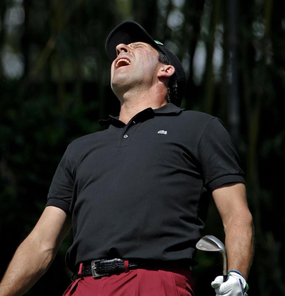 Jose Maria Olazabal, of Spain, reacts to his tee shot on the third hole during the par three competition at the Masters golf tournament Wednesday, April 9, 2014, in Augusta, Ga. (AP Photo/Matt Slocum)