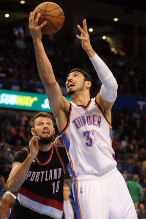 Apr 13, 2015; Oklahoma City, OK, USA; Oklahoma City Thunder center Enes Kanter (34) shoots the ball against Portland Trail Blazers center Joel Freeland (19) during the fourth quarter at Chesapeake Energy Arena. Mark D. Smith-USA TODAY Sports/Files