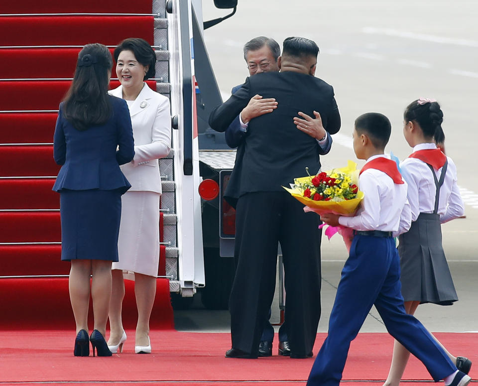 In this Tuesday, Sept. 18, 2018, file photo, South Korean President Moon Jae-in, third from left, and his wife Kim Jung-sook, second from left, are welcomed by North Korean leader Kim Jong Un and his wife Ri Sol Ju upon their arrival at Sunan International Airport in Pyongyang in North Korea. (Pyongyang Press Corps Pool via AP, File)