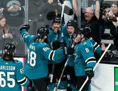 Apr 18, 2019; San Jose, CA, USA; San Jose Sharks center Tomas Hertl (48) celebrates with center Joe Thornton (19) and center Joe Pavelski (8) and defenseman Brent Burns (88) after scoring a goal against Vegas Golden Knights in the third period of game five of the first round of the 2019 Stanley Cup Playoffs at SAP Center at San Jose. Mandatory Credit: John Hefti-USA TODAY Sports