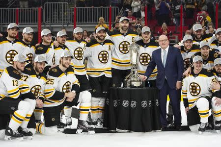 May 16, 2019; Raleigh, NC, USA; Boston Bruins players celebrate with the Prince of Wales trophy and NHL deputy commissioner Bill Daly after defeating the Carolina Hurricanes in game four of the Eastern Conference Final of the 2019 Stanley Cup Playoffs at PNC Arena. The Boston Bruins defeated the Carolina Hurricanes 4-0. Mandatory Credit: James Guillory-USA TODAY Sports