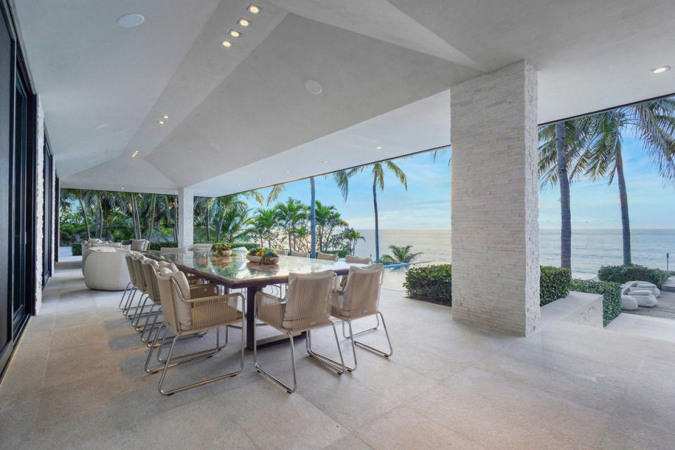 A spacious loggia overlooks the swimming pool and ocean.