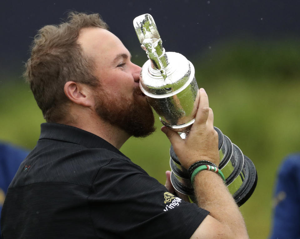 Ireland's Shane Lowry holds and kisses the Claret Jug trophy after winning the British Open Golf Championships at Royal Portrush in Northern Ireland, Sunday, July 21, 2019.(AP Photo/Peter Morrison)