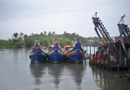 Fishing boats that stayed off the Arabian Sea due to Cyclone Tauktae are anchored in the backwaters in Kochi, Kerala state, India, Sunday, May 16, 2021. A severe cyclone is roaring in the Arabian Sea off southwestern India with winds of up to 140 kilometers per hour (87 miles per hour), already causing heavy rains and flooding that have killed at least four people, officials said Sunday. (AP Photo/R S Iyer)