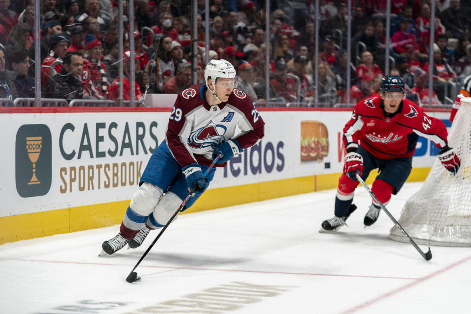 Colorado Avalanche center Nathan MacKinnon (29) skates toward the net in front of Washington Capitals defenseman Martin Fehervary (42) during the second period of an NHL hockey game, Tuesday, Feb. 13, 2024, in Washington. (AP Photo/Stephanie Scarbrough)