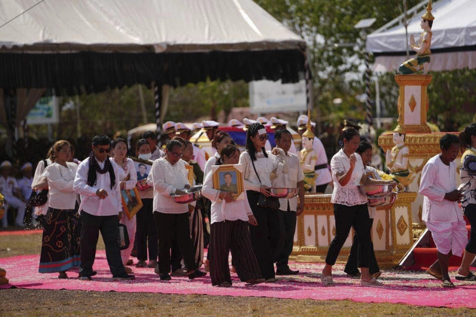 FILE - In this photo released by Agence Kampuchea Press (AKP), Cambodian soldiers' relatives gather for the funeral procession to all who died during an ammunition explosion in an army base in Kampong Speu province, Cambodia, on April 28, 2024. A huge explosion in southwestern Cambodia over the weekend that killed 20 soldiers at an army base appears to have been an accident caused by mishandling of ammunition by troops, a senior military official said Tuesday, April 30. (AKP via AP, File)