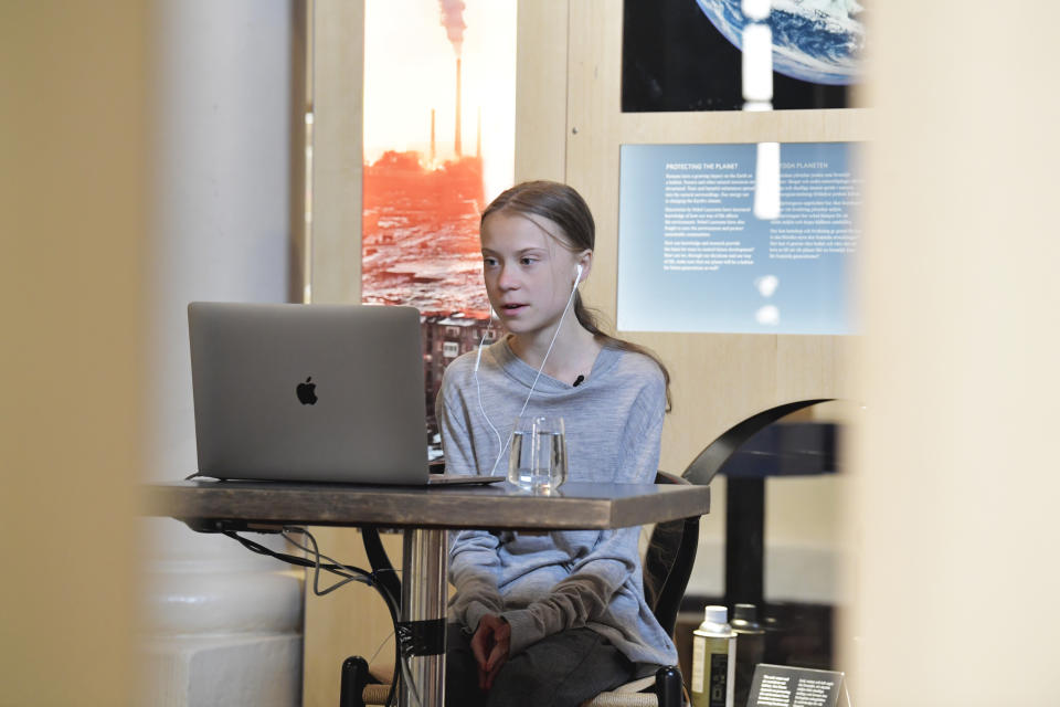 Environmental activist Greta Thunberg talks via video link with Professor of Environmental Science Johan Rockstrom in Germany, during a live chat on International Earth Day where they discussed the coronavirus pandemic and the environment, at the Nobel Museum in Stockholm, Sweden, Wednesday, April 22, 2020. (Jessica Gow/TT News Agency via AP)