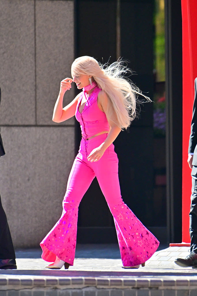 Margot Robbie was seen wearing all pink as she was all smiles while filming the new Barbie Movie on June 25 in L.A. - Credit: Mega