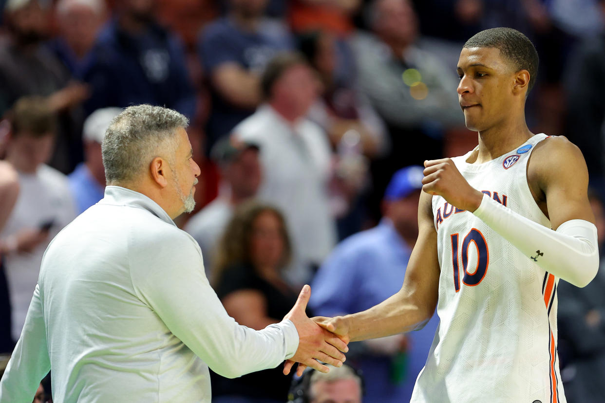 Auburn head coach Bruce Pearl and forward Jabari Smith, who is the projected No. 1 overall NBA draft pick, during the 2022 NCAA men's tournament. (Kevin C. Cox/Getty Images)