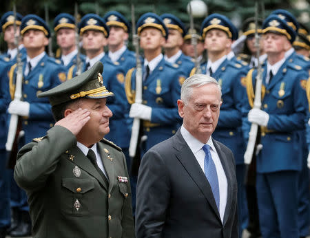 U.S. Secretary of Defense James Mattis and Ukraine's Defence Minister Stepan Poltorak walk past honour guards during a welcoming ceremony in Kiev, Ukraine August 24, 2017. REUTERS/Gleb Garanich