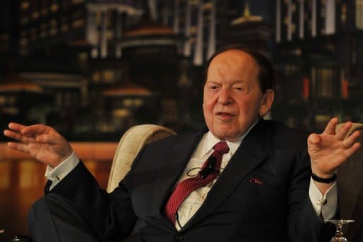 Chairman and CEO of Las Vegas Sands Corporation Sheldon Adelson gestures at a press conference before the opening of the Sands Cotai Central, Sands' newest integrated resort in Macau before its opening, April 2012. US gaming tycoon Sheldon Adelson's Macau-based subsidiary Sands China said it is under investigation over the transfer of data from the Chinese territory to the United States