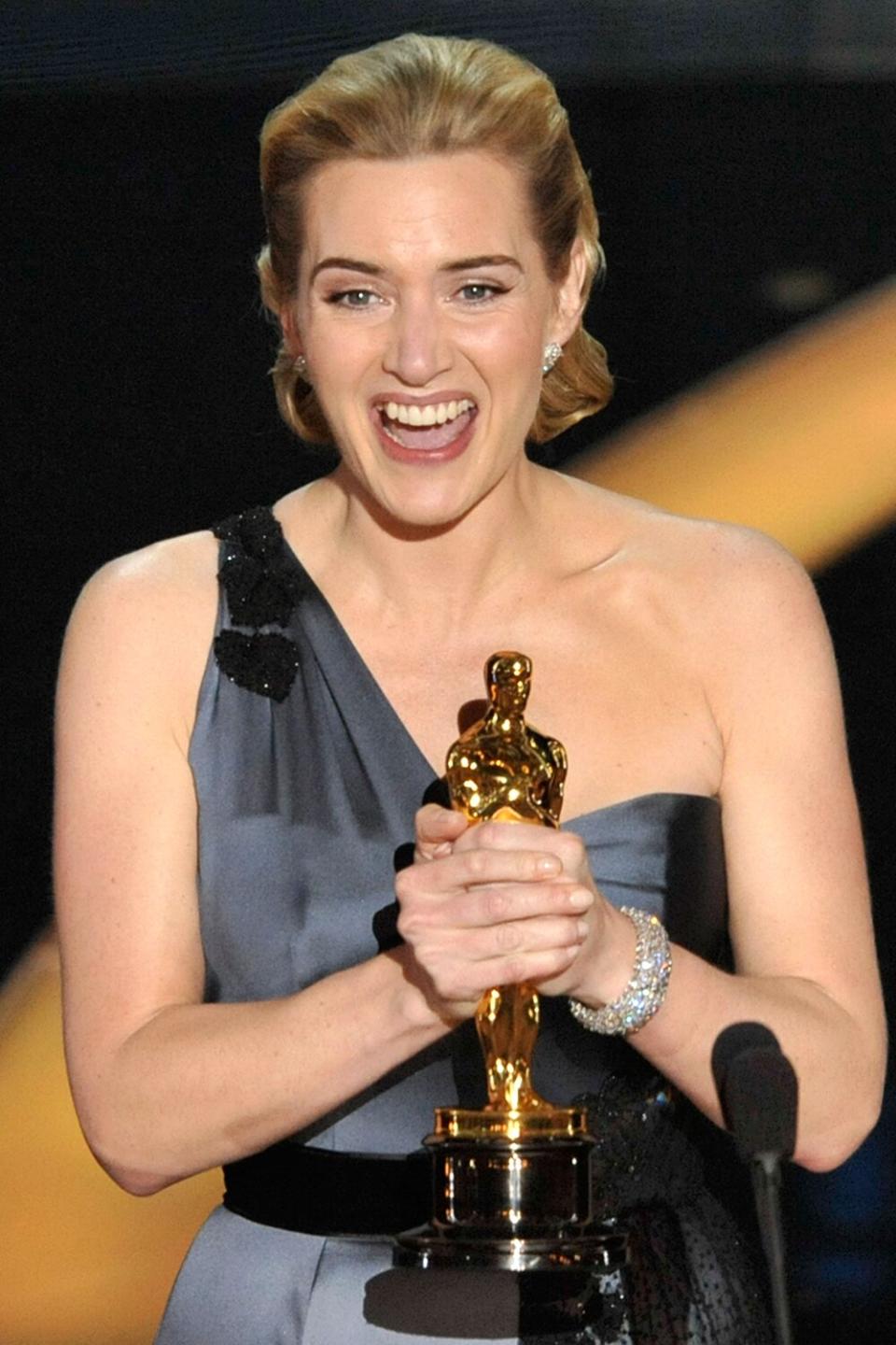 LOS ANGELES, CA - FEBRUARY 22: (EDITORS NOTE: NO ONLINE, NO INTERNET, EMBARGOED FROM INTERNET AND TELEVISION USAGE UNTIL THE CONCLUSION OF THE LIVE OSCARS TELECAST) Actress Kate Winslet speaks on stage after winning the Best Actress award for "The Reader" during the 81st Annual Academy Awards held at Kodak Theatre on February 22, 2009 in Los Angeles, California. (Photo by Kevin Winter/Getty Images)