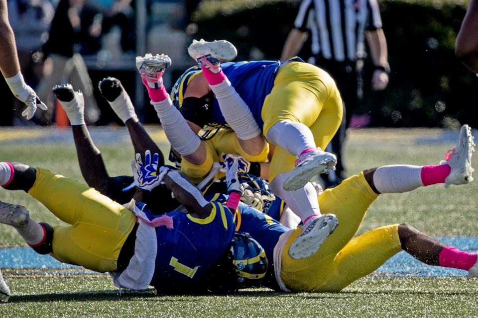 The Delaware Blue Hens defense takes down the Morgan State Bears offense during the homecoming football game at Delaware Stadium, Saturday, Oct. 22, 2022. Delaware won 38-7.