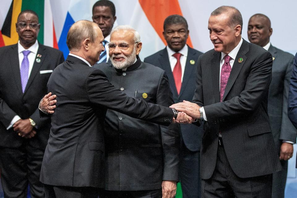 Russian President Vladimir Putin, Indian Prime Minister Narendra Modi and Turkish President Tayyip Erdogan interact before a group picture at the BRICS summit meeting in Johannesburg, South Africa, July 27, 2018. Gianluigi Guercia/Pool via REUTERS - RC1D4961EED0