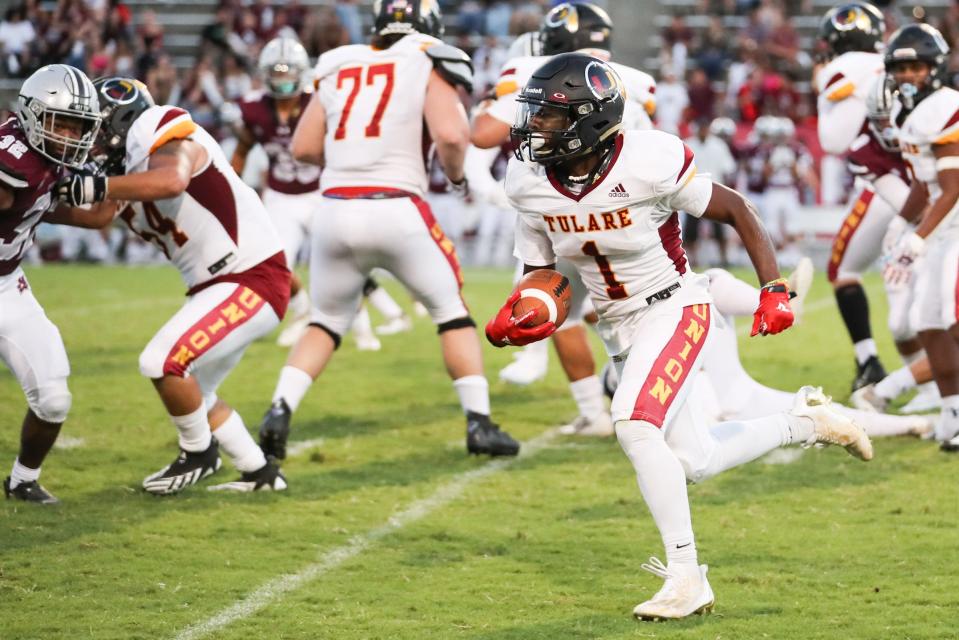 Tulare Union's Brayden Stevenson rushes against Mt. Whitney in a non-league high school football game at Mineral King Bowl on August 18th, 2023.