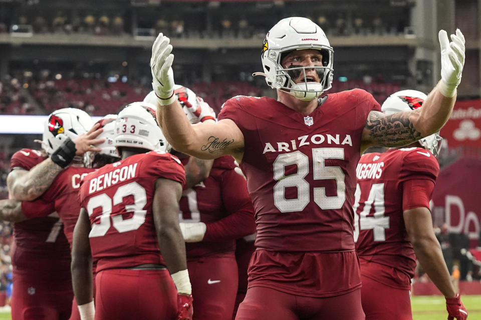 Arizona Cardinals tight end Trey McBride (85) celebrates the touchdown by running back James Conner during the second half of an NFL football game against the Los Angeles Rams, Sunday, Sept. 15, 2024, in Glendale, Ariz. (AP Photo/Ross D. Franklin)