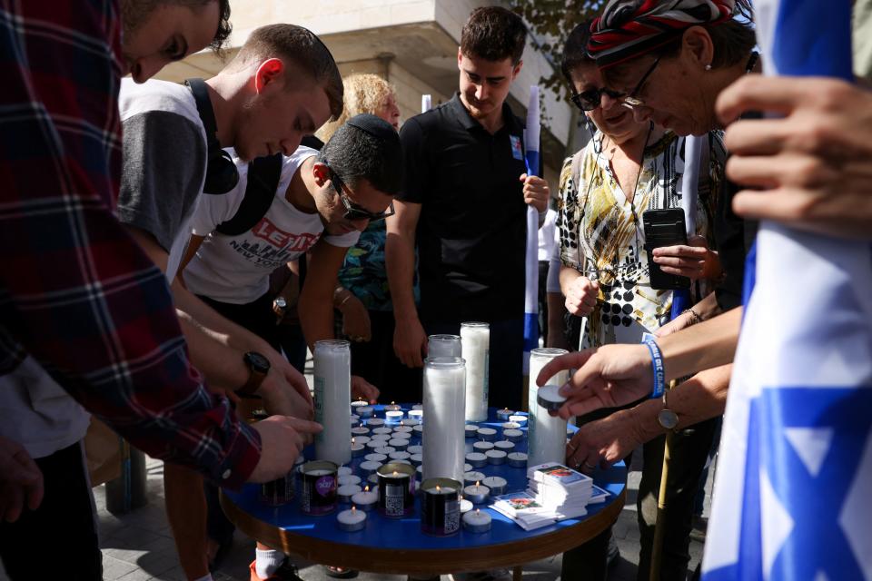 People light candles on the one-month anniversary of Hamas’s attack on Israel on 7 October which left 1,400 dead (REUTERS)
