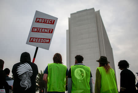 FILE PHOTO - Supporters of Net Neutrality protest the FCC's recent decision to repeal the program in Los Angeles, California, November 28, 2017. REUTERS/ Kyle Grillot