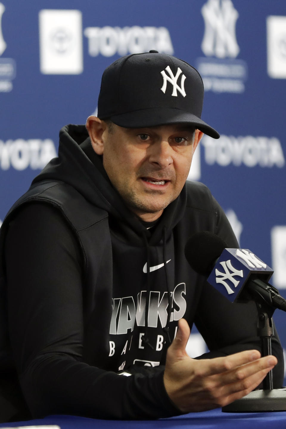 FILE - New York Yankees manager Aaron Boone speaks during a news conference before the start of spring training baseball in Tampa, Fla., in this Wednesday, Feb. 12, 2020, file photo. The New York Yankees announced Wednesday, March 3, 2021, that manager Aaron Boone is taking an immediate medical leave of absence to receive a pacemaker. (AP Photo/Frank Franklin II, File)