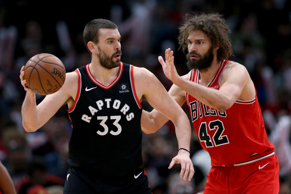 CHICAGO, ILLINOIS - MARCH 30:  Marc Gasol #33 of the Toronto Raptors handles the ball while being guarded by Robin Lopez #42 of the Chicago Bulls in the second quarter at the United Center on March 30, 2019 in Chicago, Illinois. NOTE TO USER: User expressly acknowledges and agrees that, by downloading and or using this photograph, User is consenting to the terms and conditions of the Getty Images License Agreement. (Photo by Dylan Buell/Getty Images)