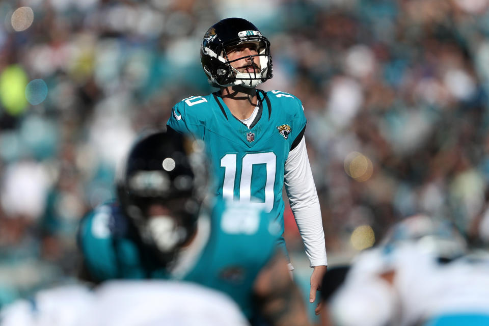 JACKSONVILLE, FLORIDA - DECEMBER 31: Brandon McManus #10 of the Jacksonville Jaguars lines up a field goal during the first half of a game against the Carolina Panthers at EverBank Stadium on December 31, 2023 in Jacksonville, Florida. (Photo by Courtney Culbreath/Getty Images)