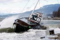 <p>A sailboat crashes in heavy waves against a beach near English Bay after rainstorms lashed the western Canadian province of British Columbia in Vancouver, British Columbia, Canada November 15, 2021. REUTERS/Jesse Winter</p> 