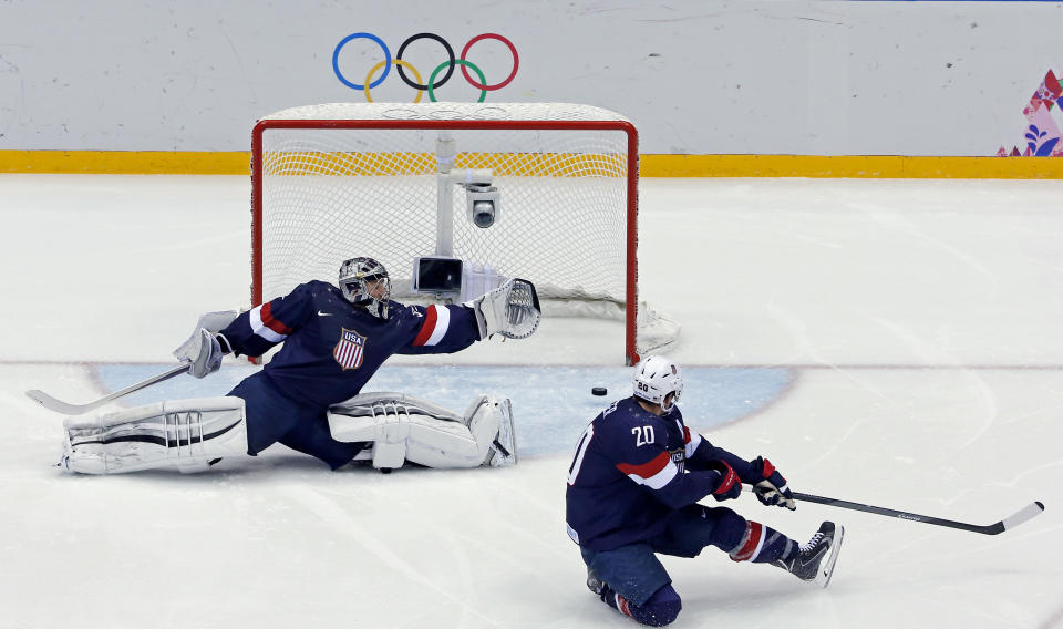 USA goaltender Jonathan Quick and defenseman can't stop a goal by Finland's Sami Salo of the men's bronze medal ice hockey game at the 2014 Winter Olympics, Saturday, Feb. 22, 2014, in Sochi, Russia. (AP Photo/David J. Phillip )