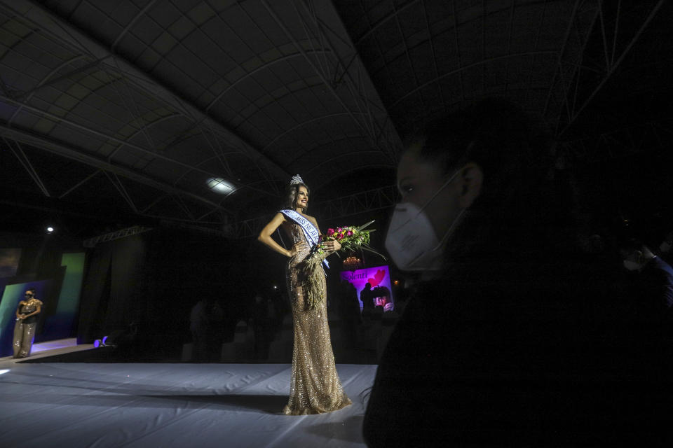 Ana Marcelo, an agroindustrial engineer from the city of Esteli, poses with the crown after being chosen Miss Nicaragua, in Managua, Nicaragua, Saturday, Aug. 8, 2020. Marcelo was crowned in front of a limited audience (two people per contestant spaced safely) plus a production crew of 85. The masks were off the contestants, but the judges wore them and were spaced at a safe distance. (AP Photo/Alfredo Zuniga)