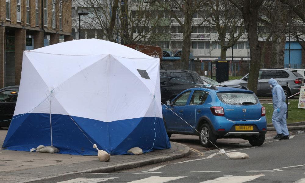 The scene in Enfield, north London, where a man died after being found shot and stabbed in the street.