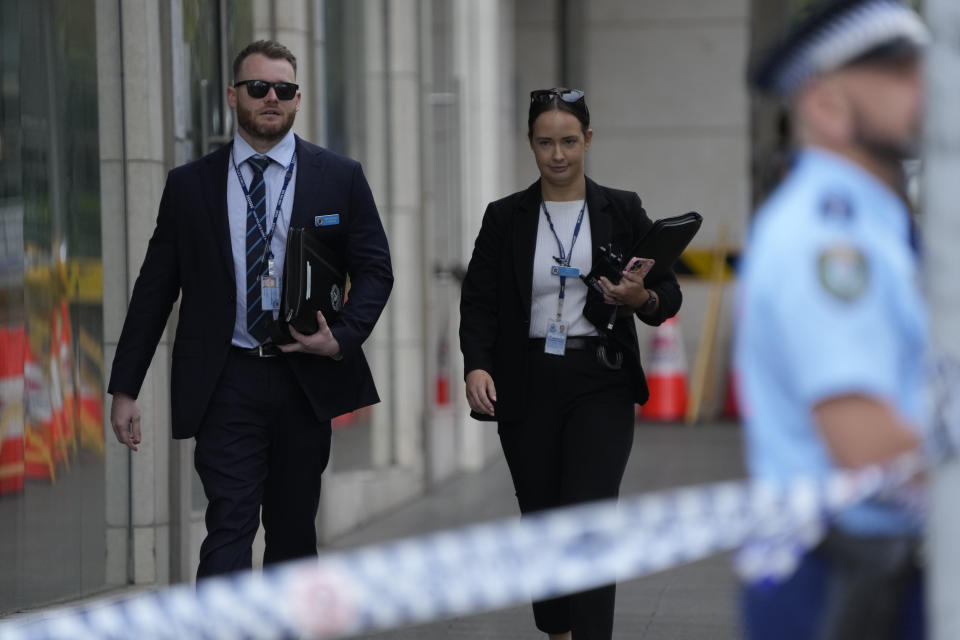 Police investigators attend a scene at Bondi Junction in Sydney, Sunday, April 14, 2024, after several people were stabbed to death at a shopping center Saturday. Police have identified Joel Cauchi, 40, as the assailant that stabbed several people to death at a busy Sydney shopping center Saturday before he was fatally shot by a police officer. (AP Photo/Rick Rycroft)