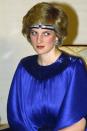 <p>Wearing a diamond and sapphire headband across her forehead and under her hair at a dinner hosted by Emperor Hirohito while on a visit to Japan. </p>